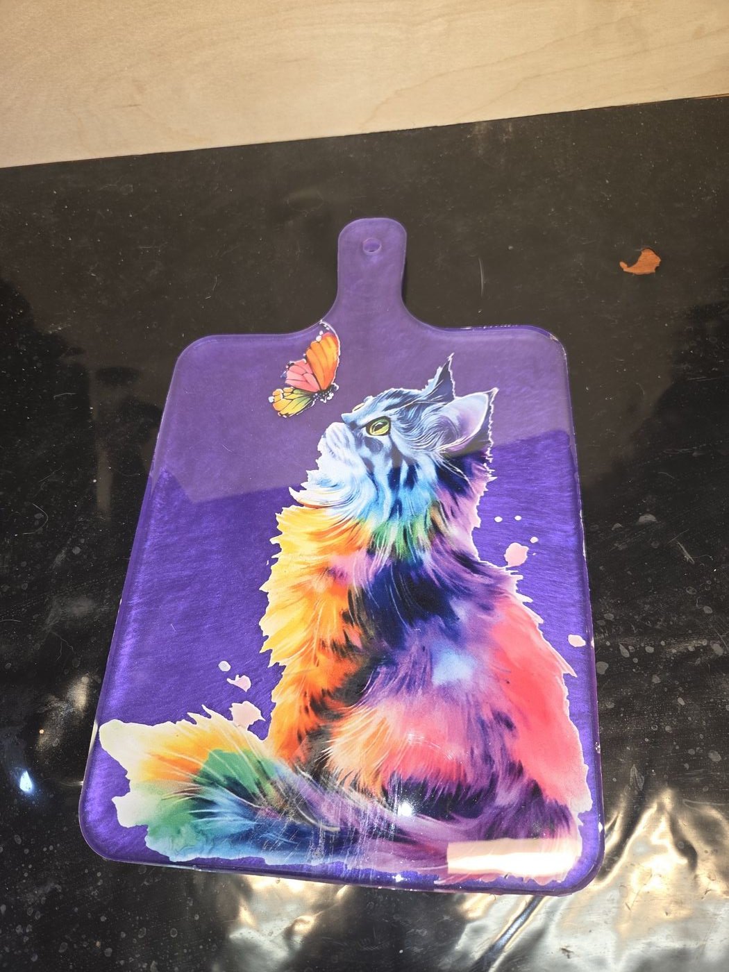 Large purple board with rainbow watercolor cat